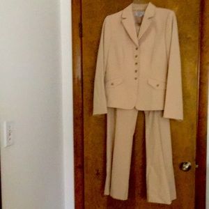 Woman’s tan pantsuit